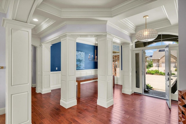 4905 Peifer Ln, Champaign, IL 61822 - foyer with ornate columns, a decorative wall, ornamental molding, dark wood-style flooring, and wainscoting