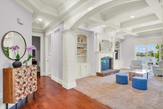 4905 Peifer Ln, Champaign, IL 61822 - living room with coffered ceiling, ornamental molding, dark wood-style floors, recessed lighting, and a brick fireplace