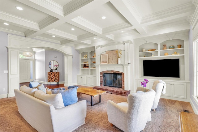 4905 Peifer Ln, Champaign, IL 61822 - living area featuring beam ceiling, crown molding, built in shelves, arched walkways, and ornate columns