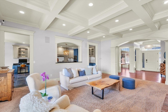 4905 Peifer Ln, Champaign, IL 61822 - living room featuring ornate columns, arched walkways, coffered ceiling, ornamental molding, and wood finished floors