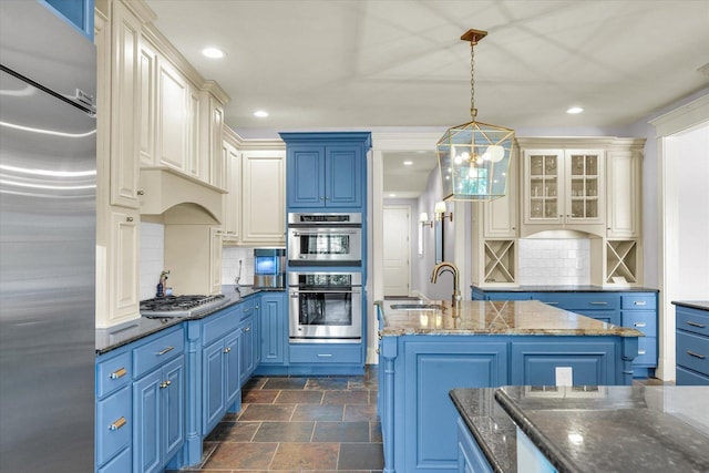 4905 Peifer Ln, Champaign, IL 61822 - kitchen with appliances with stainless steel finishes, blue cabinets, backsplash, dark stone finish floors, and recessed lighting