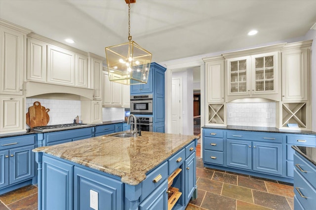 4905 Peifer Ln, Champaign, IL 61822 - kitchen featuring blue cabinetry, appliances with stainless steel finishes, a chandelier, recessed lighting, and a center island with sink