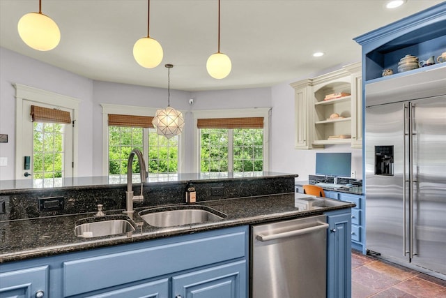 4905 Peifer Ln, Champaign, IL 61822 - kitchen with appliances with stainless steel finishes, open shelves, blue cabinets, healthy amount of natural light, and recessed lighting