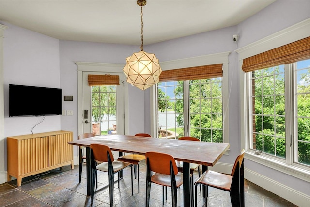 4905 Peifer Ln, Champaign, IL 61822 - dining area with baseboards and stone tile flooring