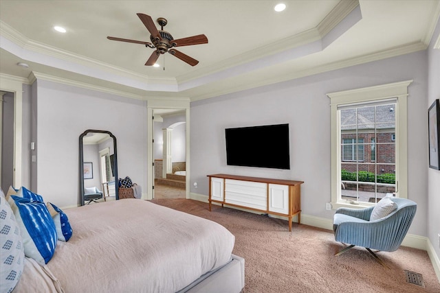 4905 Peifer Ln, Champaign, IL 61822 - carpeted bedroom featuring arched walkways, a raised ceiling, ornamental molding, ceiling fan, and recessed lighting