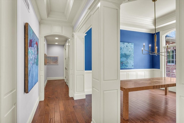 4905 Peifer Ln, Champaign, IL 61822 - hall with dark wood finished floors, a chandelier, wainscoting, a decorative wall, and ornamental molding