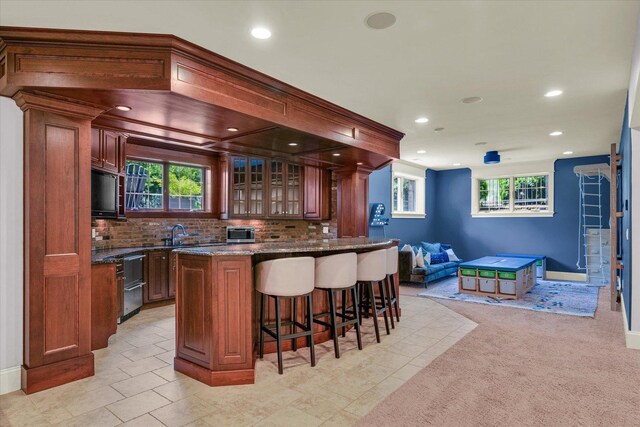 4905 Peifer Ln, Champaign, IL 61822 - home theater room with wainscoting, carpet, ornamental molding, wood walls, and recessed lighting