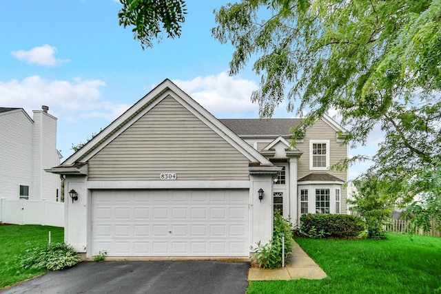 8304 Trumbull Ave, Joliet, IL 60431 - traditional-style house with driveway and an attached garage