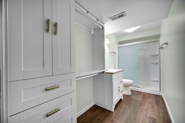 8304 Trumbull Ave, Joliet, IL 60431 - full bathroom with a stall shower, wood finished floors, and vanity