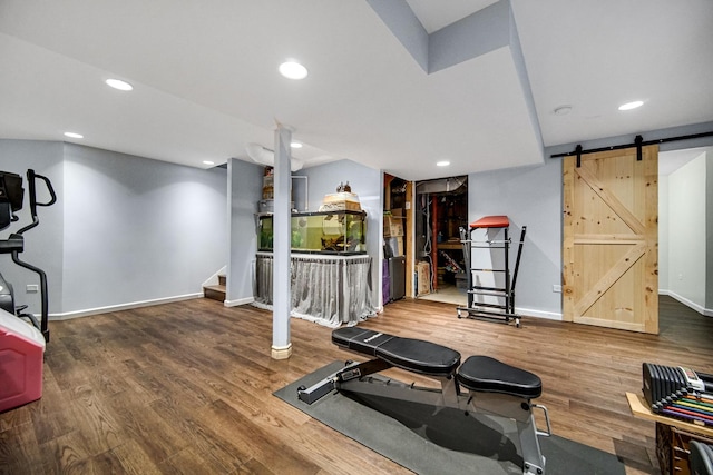 8304 Trumbull Ave, Joliet, IL 60431 - exercise area with a barn door, wood finished floors, and recessed lighting