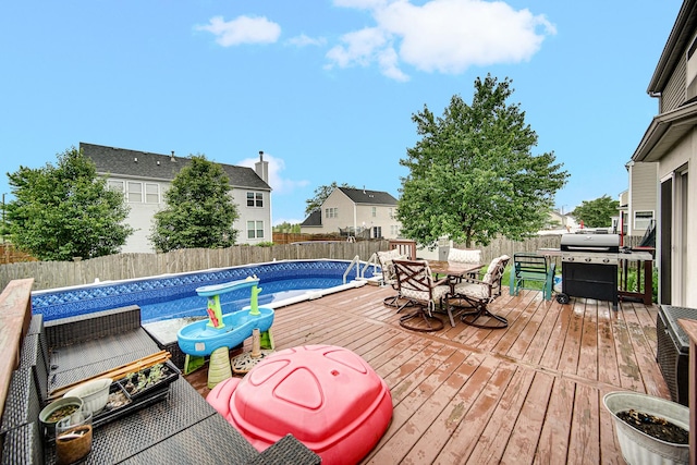 8304 Trumbull Ave, Joliet, IL 60431 - view of pool with outdoor dining space, a deck, a fenced backyard, and a residential view
