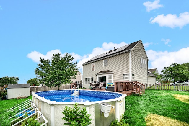 8304 Trumbull Ave, Joliet, IL 60431 - view of pool with a storage unit, a fenced backyard, and a deck