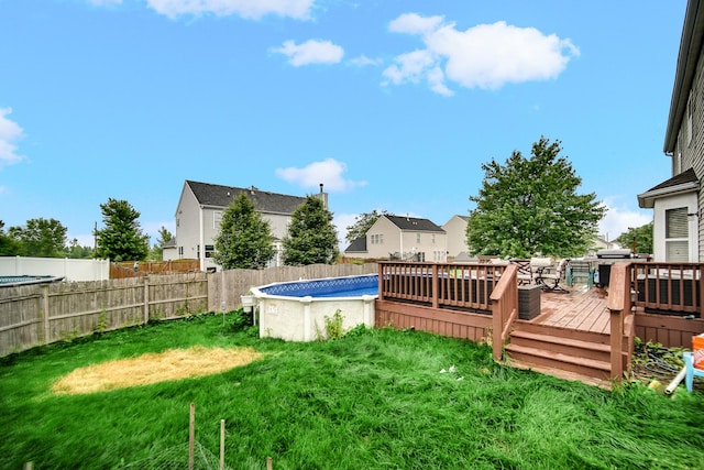 8304 Trumbull Ave, Joliet, IL 60431 - fenced backyard featuring a wooden deck