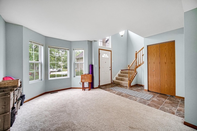 8304 Trumbull Ave, Joliet, IL 60431 - carpeted entryway with stairway and stone finish floors