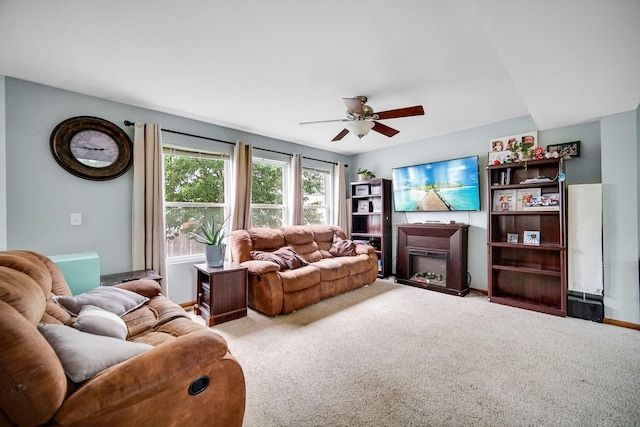 8304 Trumbull Ave, Joliet, IL 60431 - carpeted living room featuring ceiling fan and a fireplace