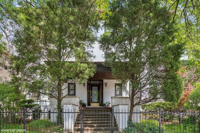4503 N Ashland Ave Unit 2N, Chicago, IL 60640 - view of front facade featuring a fenced front yard, brick siding, and stairs