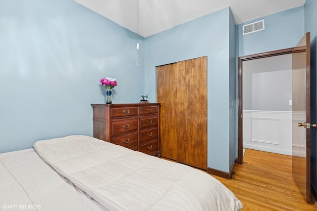 4503 N Ashland Ave Unit 2N, Chicago, IL 60640 - bedroom featuring wood finished floors and a wainscoted wall
