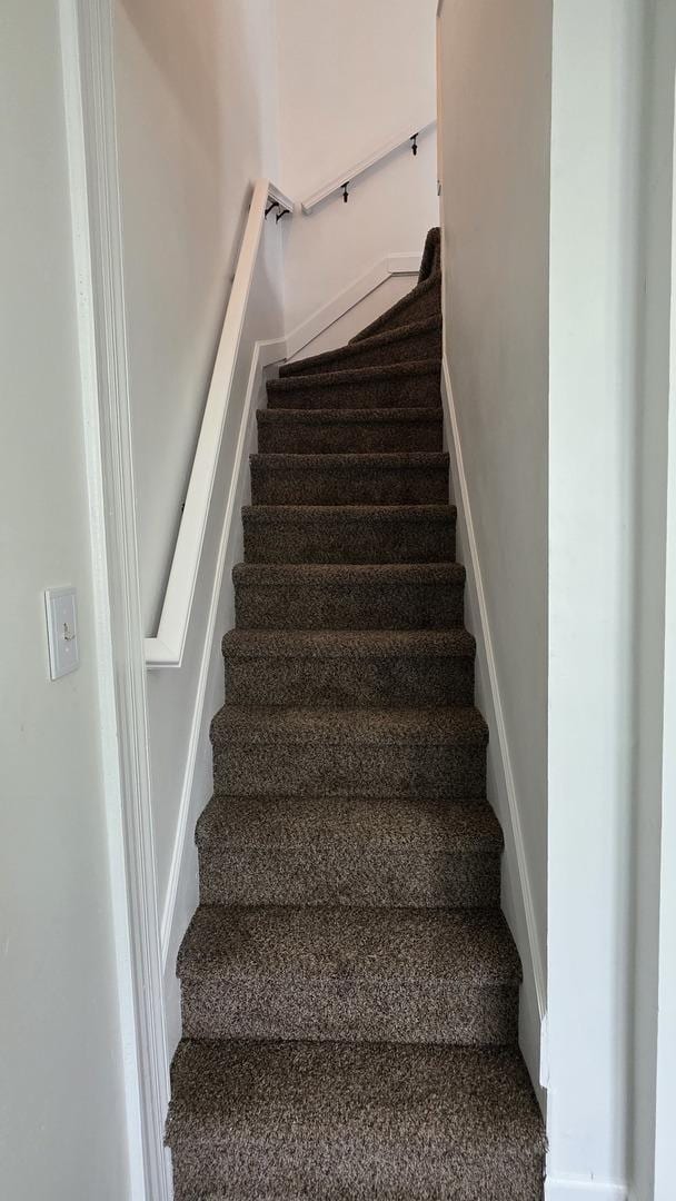 208 N Chestnut St, Aurora, IL 60506 - stairway featuring baseboards