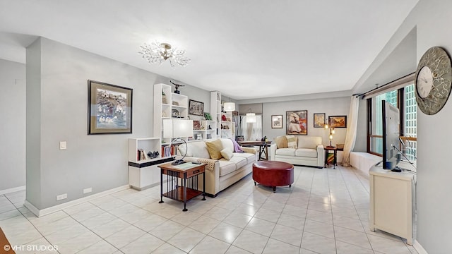 5050 S E End Ave Unit 9C, Chicago, IL 60615 - living area featuring light tile patterned floors and a chandelier