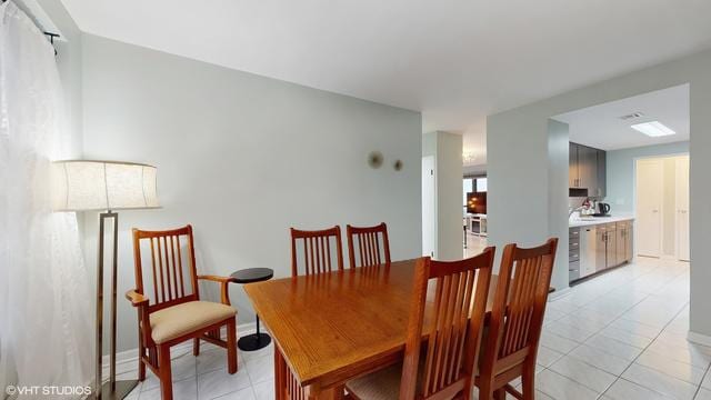 5050 S E End Ave Unit 9C, Chicago, IL 60615 - dining room featuring light tile patterned flooring