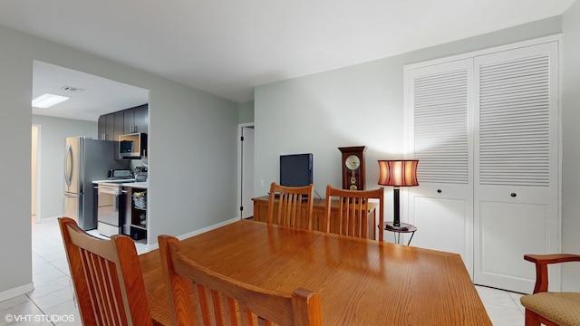 5050 S E End Ave Unit 9C, Chicago, IL 60615 - dining area with light tile patterned floors and baseboards