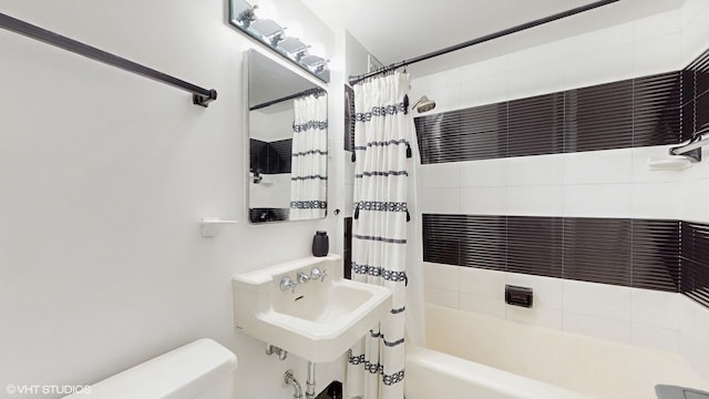 5050 S E End Ave Unit 9C, Chicago, IL 60615 - bathroom featuring shower / bath combination with curtain and toilet