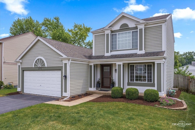 1375 Eastwood Dr, Aurora, IL 60506 - traditional-style home with asphalt driveway, a garage, and roof with shingles