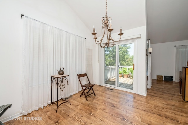 601 Cary Woods Cir Unit 601, Cary, IL 60013 - living area with a chandelier, vaulted ceiling, and wood finished floors