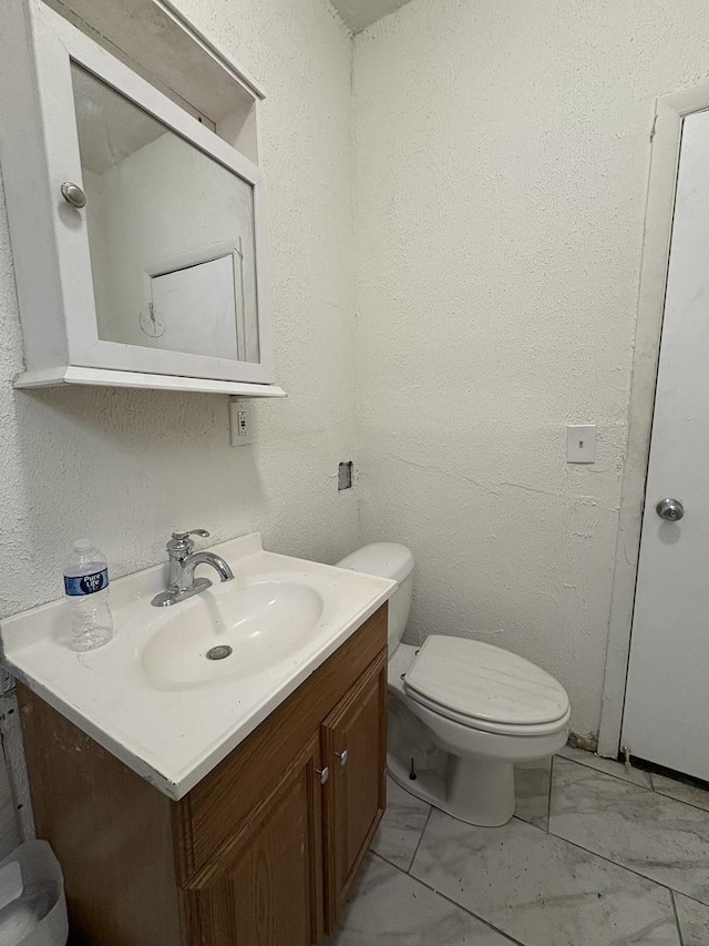 5604 S Morgan St, Chicago, IL 60621 - half bathroom with vanity and marble finish floors
