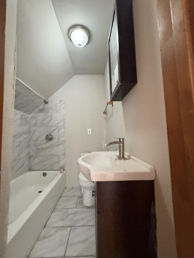 5604 S Morgan St, Chicago, IL 60621 - bathroom with vanity, marble finish flooring, shower / tub combination, and vaulted ceiling