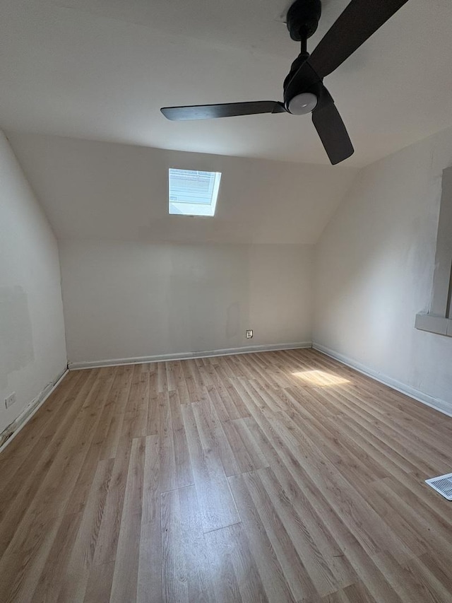 5604 S Morgan St, Chicago, IL 60621 - additional living space featuring a skylight, lofted ceiling, wood finished floors, and ceiling fan