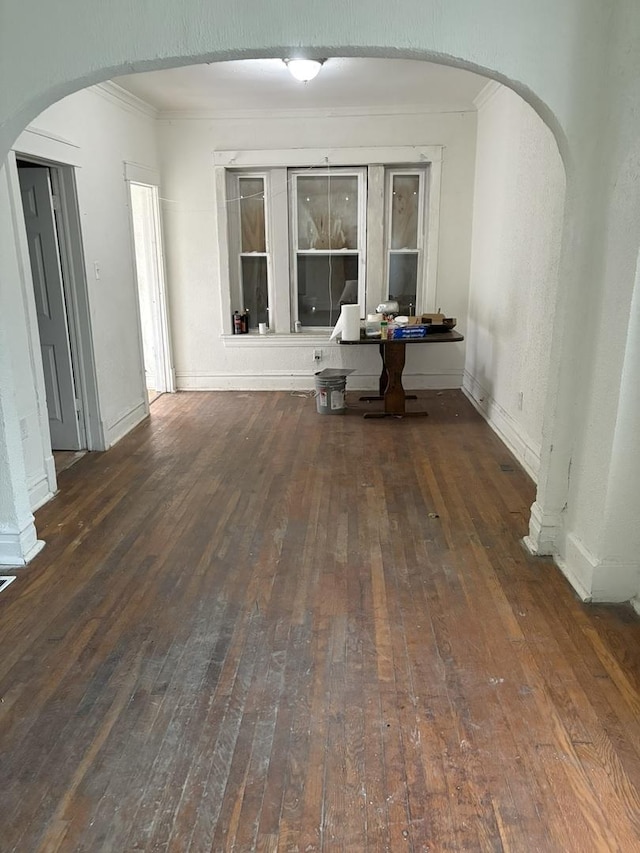 5604 S Morgan St, Chicago, IL 60621 - spare room featuring arched walkways, hardwood / wood-style floors, and ornamental molding