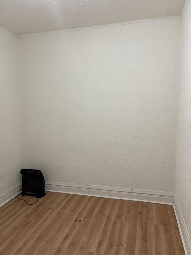 5604 S Morgan St, Chicago, IL 60621 - unfurnished room with light wood finished floors and baseboards