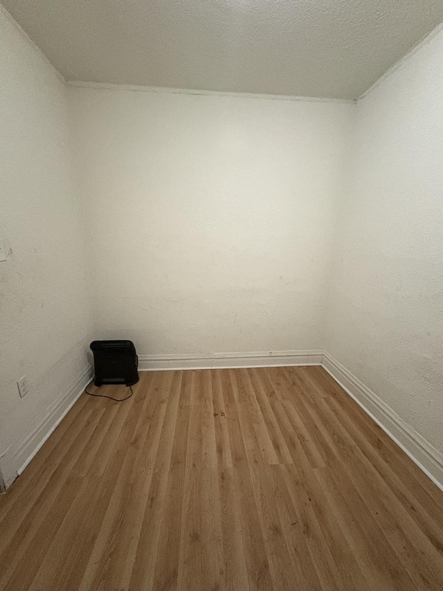 5604 S Morgan St, Chicago, IL 60621 - spare room featuring baseboards and light wood finished floors
