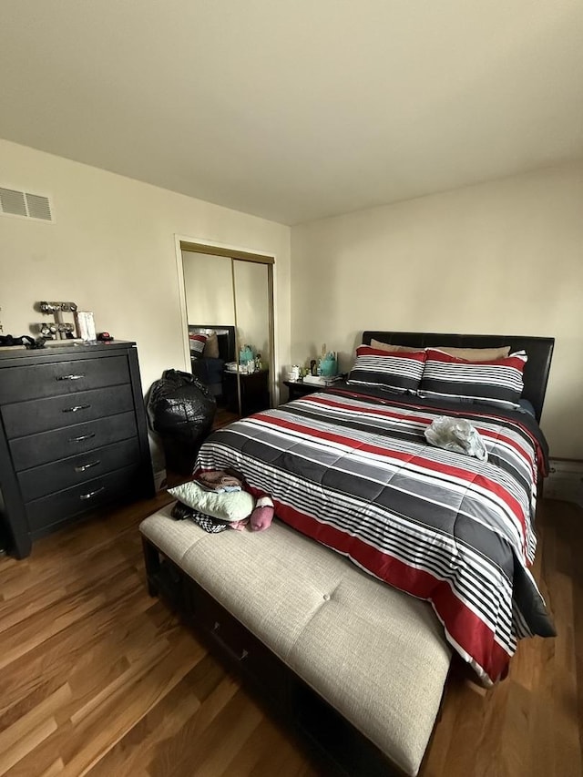 1208 E 154th St, South Holland, IL 60473 - bedroom featuring wood finished floors and a closet