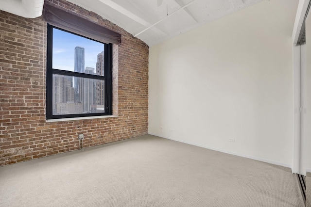 1322 S Wabash Ave Unit 807, Chicago, IL 60605 - carpeted spare room featuring vaulted ceiling, brick wall, and a view of city