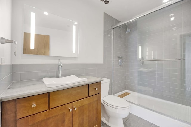 1322 S Wabash Ave Unit 807, Chicago, IL 60605 - full bathroom featuring vanity, a shower stall, tile walls, and recessed lighting