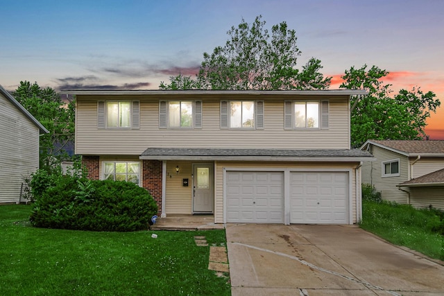 816 Blackhawk Dr, University Park, IL 60484 - view of front of house with a garage, concrete driveway, brick siding, and a front yard