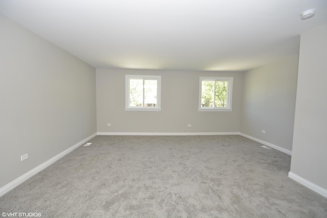 816 Blackhawk Dr, University Park, IL 60484 - empty room with a smoke detector and carpet