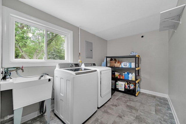 816 Blackhawk Dr, University Park, IL 60484 - laundry room with electric panel, washing machine and clothes dryer, and healthy amount of natural light