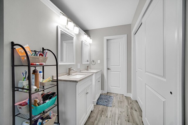 816 Blackhawk Dr, University Park, IL 60484 - bathroom with double vanity and wood finished floors