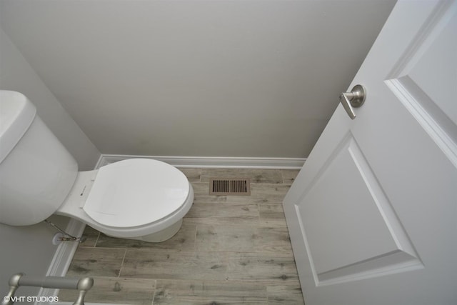 816 Blackhawk Dr, University Park, IL 60484 - bathroom with toilet and wood finished floors