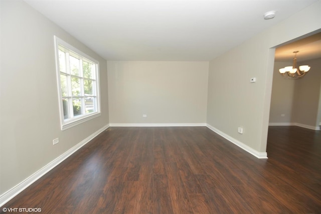 816 Blackhawk Dr, University Park, IL 60484 - unfurnished room with a chandelier, dark wood finished floors, and a smoke detector
