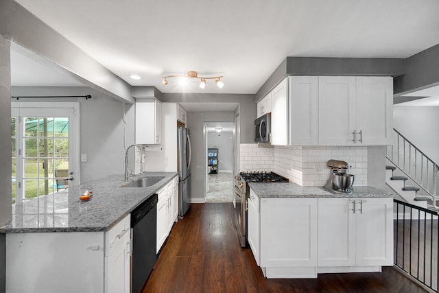 816 Blackhawk Dr, University Park, IL 60484 - kitchen featuring stainless steel appliances, light stone counters, decorative backsplash, white cabinetry, and dark wood-style flooring