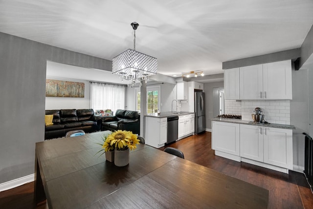 816 Blackhawk Dr, University Park, IL 60484 - dining space featuring a chandelier and dark wood-style flooring