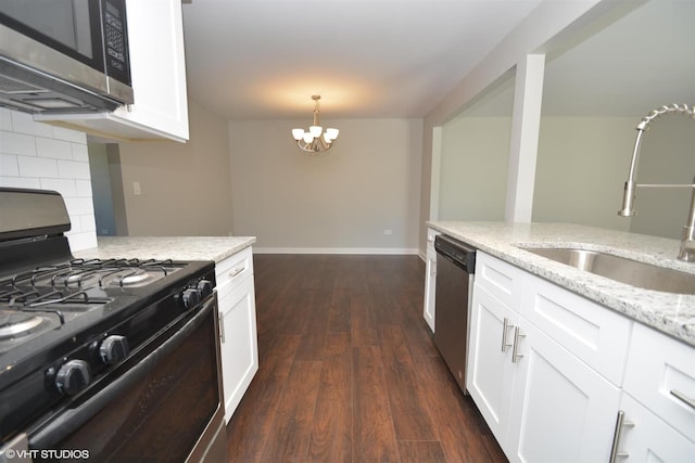 816 Blackhawk Dr, University Park, IL 60484 - kitchen with appliances with stainless steel finishes, dark wood-style floors, white cabinets, and backsplash