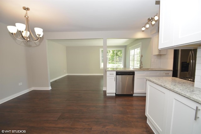 816 Blackhawk Dr, University Park, IL 60484 - kitchen featuring stainless steel appliances, a chandelier, white cabinetry, dark wood-style flooring, and light stone countertops