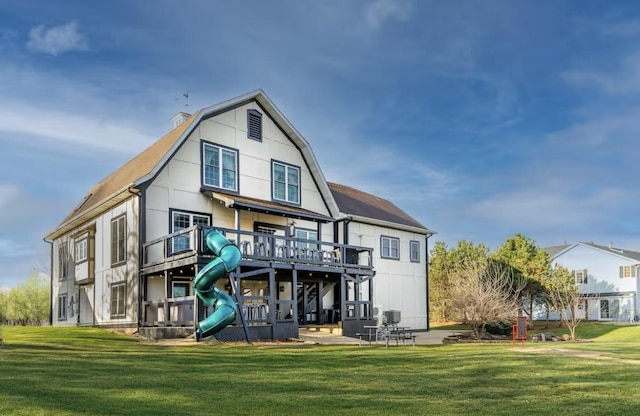 9439 Corneils Rd, Bristol, IL 60512 - rear view of property featuring a yard and a wooden deck