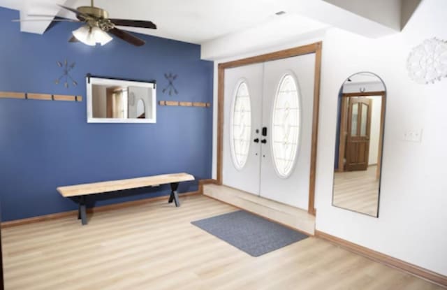 9439 Corneils Rd, Bristol, IL 60512 - entrance foyer with wood finished floors, a ceiling fan, and french doors