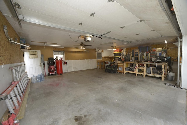 1107 W Lafayette St, Ottawa, IL 61350 - garage with ceiling fan, a garage door opener, a workshop area, and electric panel